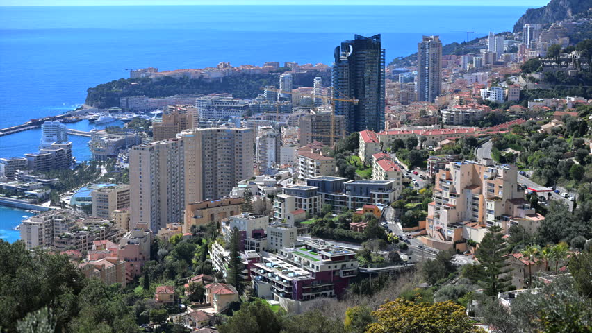 This shows the view of Monte Carlo Monaco with buildings and the sea in the background during a sunny day.