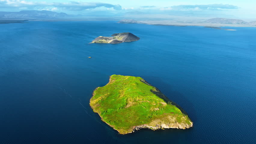 Aerial View of a Green Island in the Blue Ocean