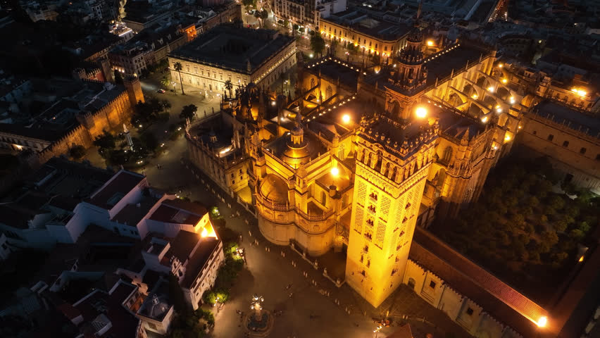 Night time aerial view of the historic old town city center of Seville, Andalusia, Spain.