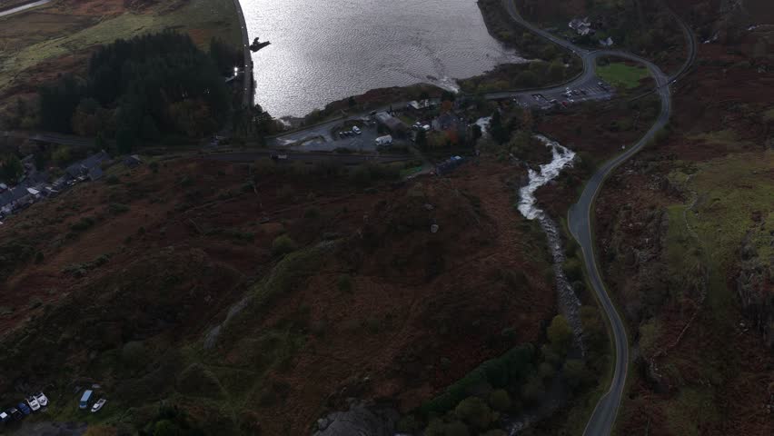 A revealing aerial drone video of Llyn Ogwen in Snowdonia National Park, showcasing its pristine mountain lake, dramatic terrain, and the serene natural beauty of North Wales.