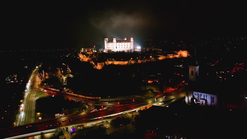 4K cinematic drone shot of Bratislava Castle illuminated at night — Slovakia_029