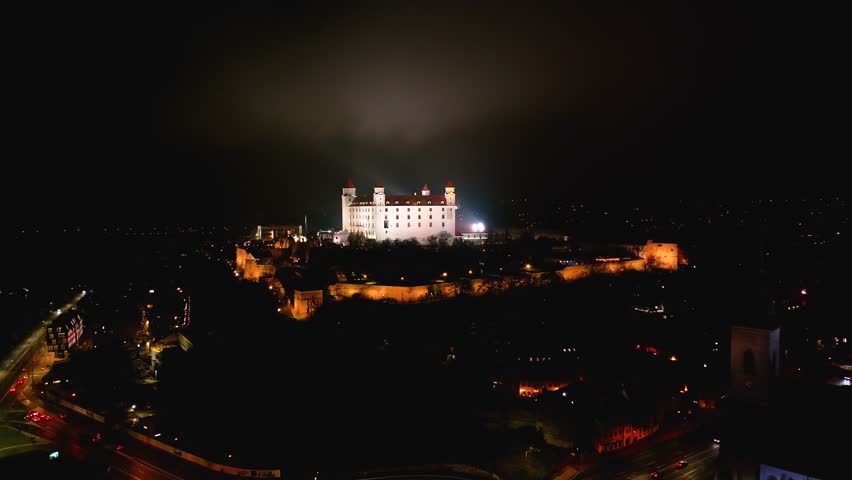 4K cinematic drone shot of Bratislava Castle illuminated at night — Slovakia_038