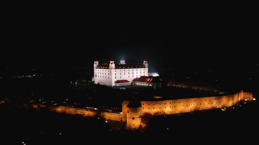 4K cinematic drone shot of Bratislava Castle illuminated at night — Slovakia_033