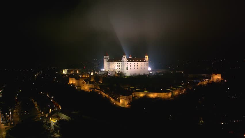 4K cinematic drone shot of Bratislava Castle illuminated at night — Slovakia_045