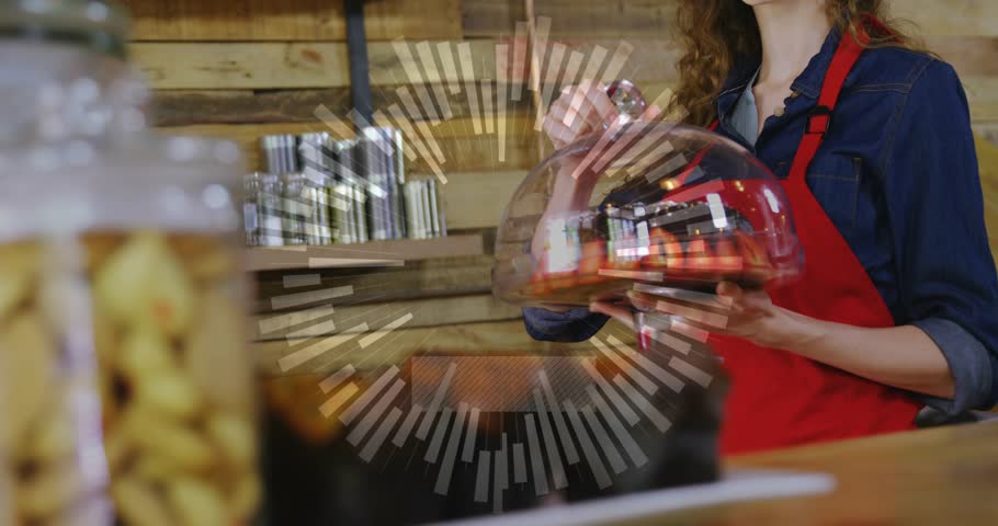 Bakery server lifting cloche and revealing bundt cake for cafe display, radial overlay appearing. Dessert, pastry, presentation, staff, warm, rustic, wood