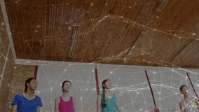 Teen male player gathering ball and jumping for layup in sports gym, particle overlay tracing shot. Basketball, hoop, backboard, court, gymnasium, lowangle, teammates - Powered by Shutterstock - Get 15% off with code: PIKWIZARD15