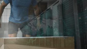 Man approaching left and lowering torso, doing box jumps for fitness while grid overlay merging. Plyometrics, jump, platform, gym, warehouse, daylight, industrial - Powered by Shutterstock - Get 15% off with code: PIKWIZARD15