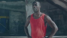 Athlete lowering gaze and tapping smartwatch, causing map overlay over torso while tracking fitness. Muscular, industrial, urban, gritty, concrete, ropes, wearable - Powered by Shutterstock - Get 15% off with code: PIKWIZARD15