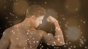 Fitness model posing to show right arm, bending elbow, tensing while warm bokeh drifting over model. Biceps, strength, flex, torso, chest, athletic, masculine - Powered by Shutterstock - Get 15% off with code: PIKWIZARD15