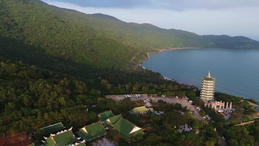 Stunning sunset view of the massive Lady Buddha statue towering over Linh Ung Pagoda on the Son Tra Peninsula in Da Nang, Vietnam