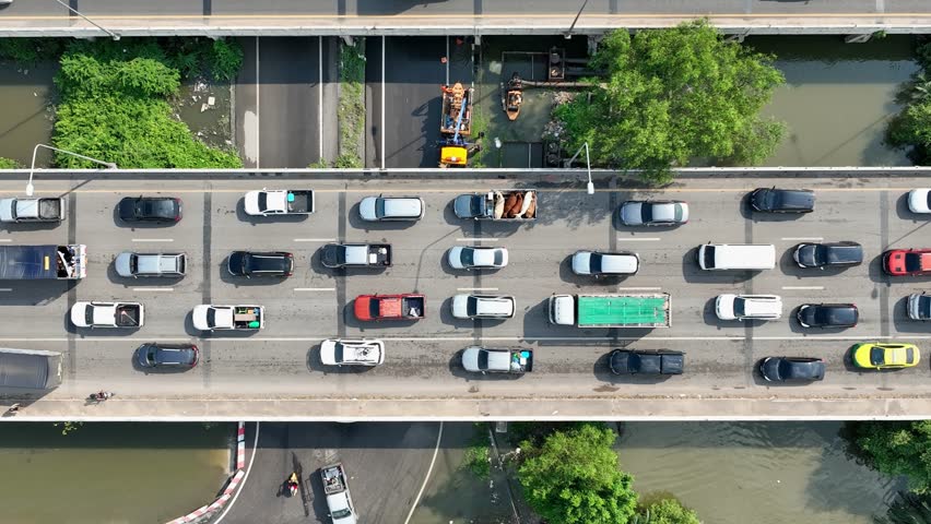 Drone-captured traffic gridlock highlights inefficient infrastructure, peak-hour pressure, fragmented mobility planning, the urgency for data-driven traffic control, and long-term urban development.
