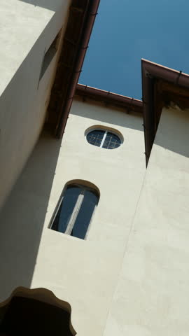 Majestic white building with intricate architecture under blue sky. Action