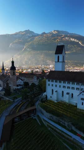 Chur Switzerland oldest city Swiss Alpine region medieval old town, aerial drone vertical video