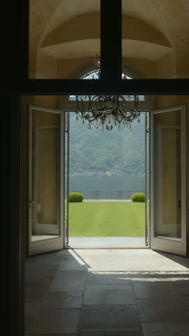 An Elegant Entrance Leading to a Beautiful Scenic Garden with a Breathtaking Mountain View. Action