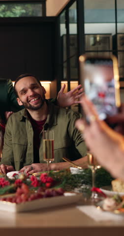 Christmas, dinner and happy family in home with photography for memories, bonding and holiday tradition. People, smile and picture in house for festive party, social media xmas post and connection.