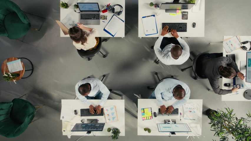 Business team uses artificial intelligence tech to automate data entry tasks, digital ecosystem HUD overlay. Top down view of company workers streamlining workflow using AI machine learning operations