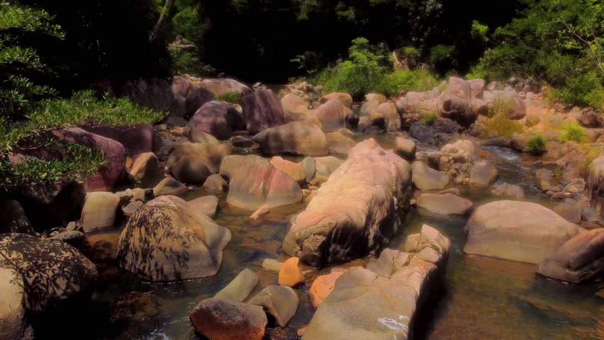 Stone blocks of a mountain river.

Baho Falls in Vietnam near Nha Trang. Cascades of a mountain river that turn into waterfalls on the lower rapids. 