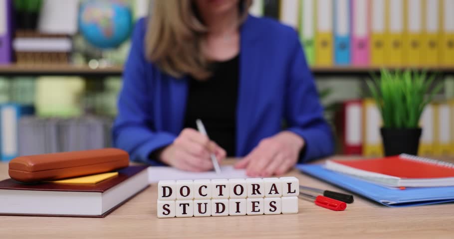 Engagement in academic pursuit with focus on doctoral studies at a tidy workspace