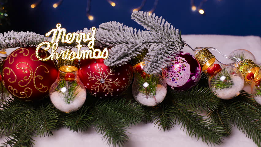 Christmas balls and unusual lights on a Christmas tree branch