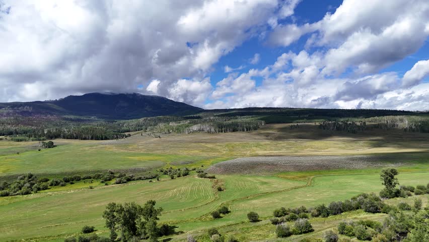 Aerial View of Beautiful Landscape of Elk Mountains in Colorado USA on Sunny Summer Day, Drone Shot