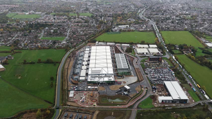 Aerial drone video of a large new-build data center in Waltham Cross, UK, showcasing expanding digital infrastructure designed to meet rising AI-driven computing and cloud processing demands.