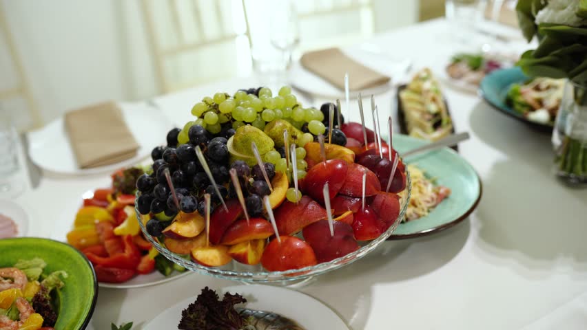 Fruit on the festive table at a banquet, a party with a buffet and food for guests. A birthday party with appetizers and dishes