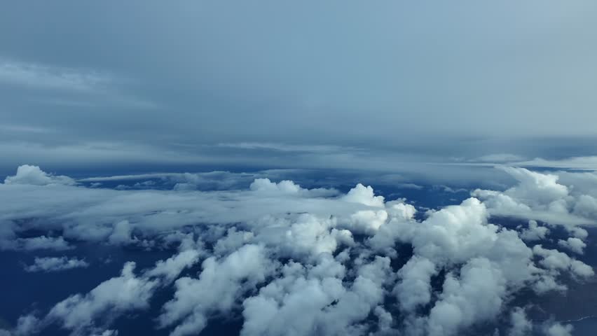 Immersive pilot’s perspective flying through stormy skies as seen by the pillots from a jet cockpit during deccent.
