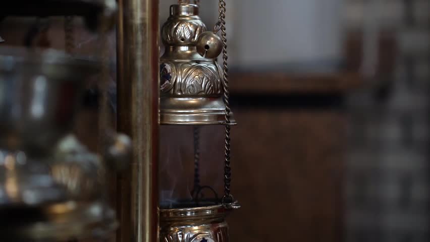 Smoke comes from the censer in the church