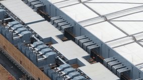 Aerial close-up view of a large data center showing servers, cooling systems, and digital infrastructure used for AI computing, cloud processing, and high-performance big data operations. - Powered by Shutterstock - Get 15% off with code: PIKWIZARD15