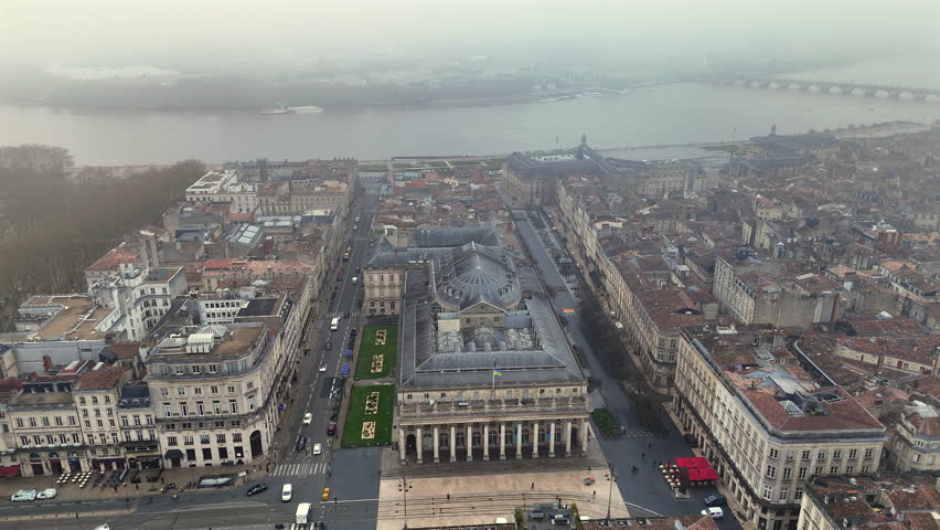 4K drone orbit Grand Theatre Bordeaux Haussmann buildings and tram tracks