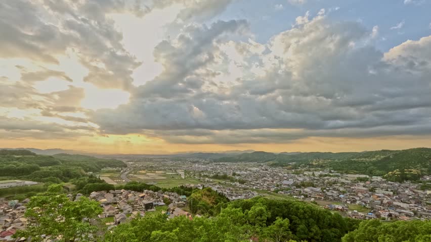 A time lapse of clouds, looking out over the city from the top of the hill. 