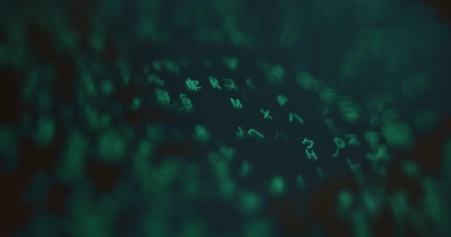 Falling green neon symbols on screen, selective focus