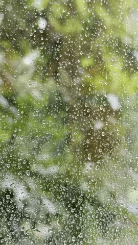 Rain drops on window. Rainy autumn weather.