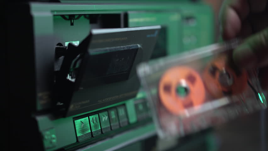 Starting Playback of Audio Cassette Tape in Old Double Deck Player Recorder, Cigarette Smoke, Close Up