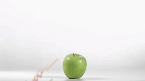 Syringe descending and injecting blue liquid into green apple, graphs rising to show test data. Fruit, needle, puncture, stem, overlay, line, chart - Powered by Shutterstock - Get 15% off with code: PIKWIZARD15