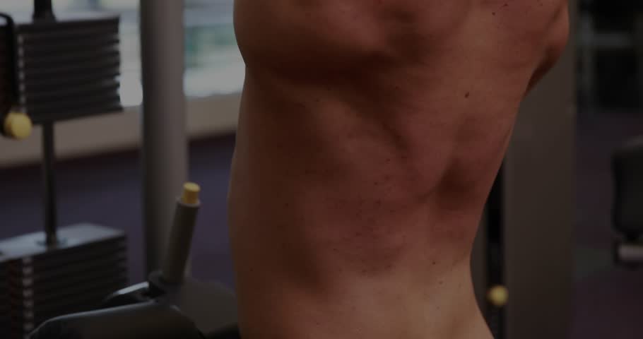 Adult male gripping lat pulldown bar and pulling down, translucent fitness charts tracking reps. Cable, weights, athlete, torso, gym, natural, overlay