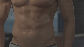 Male athlete posing while camera moving upward, showing abs, chest, turning head, windows. Torso, physique, fitness, athlete, studio, backlit, sweat - Powered by Shutterstock - Get 15% off with code: PIKWIZARD15