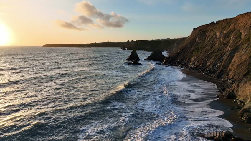 Ireland epic locations waves crashing on beach at dusk Waterford seascape