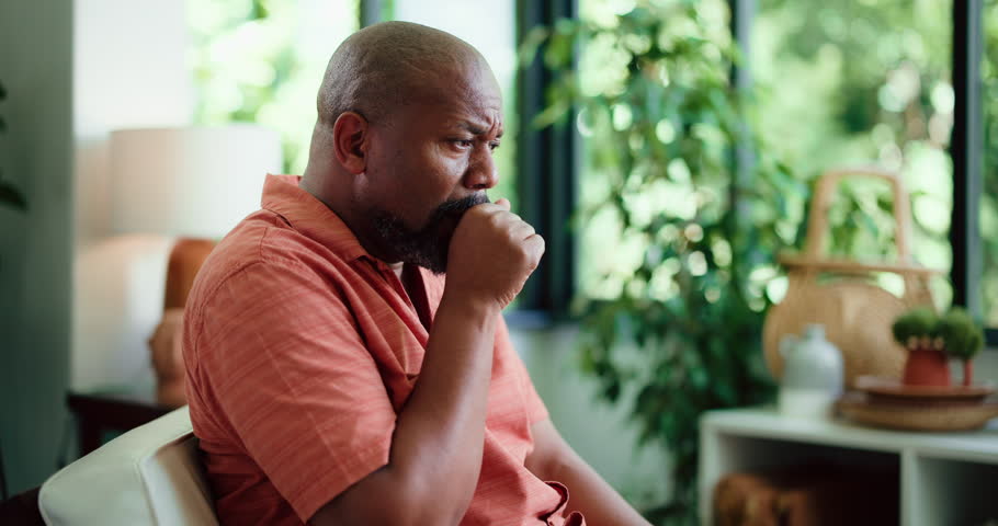 Sick, cough and black man in house with chest pain, infection or breathing problem in lung virus. Influenza, choking or mature person in home with tuberculosis, asthma or illness in allergy season.