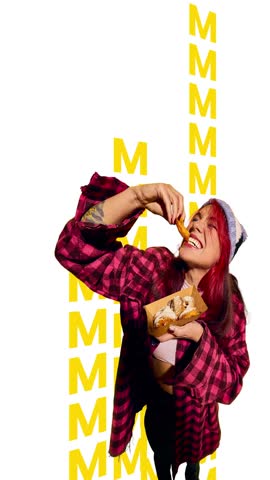 Promo video. Girl in streetwear biting donut on white background filled with moving yellow letter lines. Concept of urban snacking, youth visuals, dynamic typography for social and marketing use.