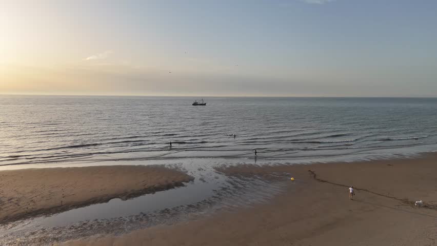 fishing boat at sea at sunset
