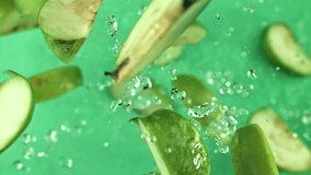 Pieces of green apples fly up and fall down. Filmed on a high-speed camera at 1000 fps. High quality FullHD footage - Powered by Shutterstock - Get 15% off with code: PIKWIZARD15