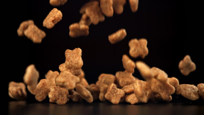 Dog food falls on the table. Filmed on a high-speed camera at 1000 fps. High quality FullHD footage