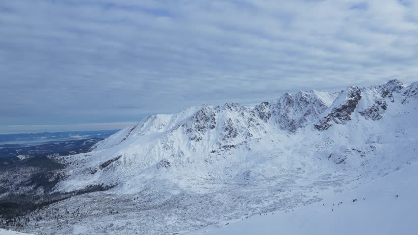 Mountain top, snow-capped peak, rocks, panorama of Kasprowy Wierch, Poland.