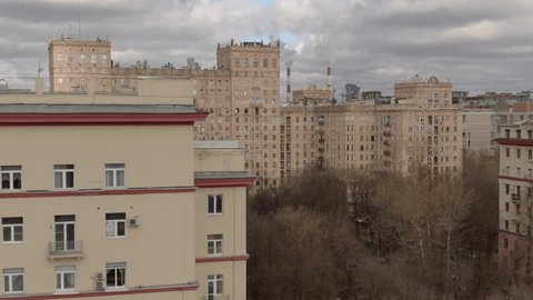 Drone Rising Sideways across Urban Residential Area