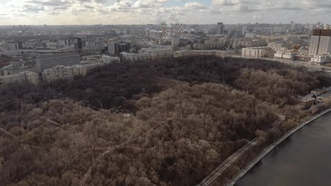 Sideward Rotating Drone View over Urban Park