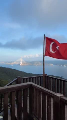 Soaring high above the Bosphorus, the Turkish Flag waves, symbolizing centuries of pride and history. A breathtaking view from the observation tower where East meets West. My beautiful Turkey.