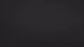 Real black paper rips vertically and slides sideways, revealing footage with a clean paper transition.
 - Powered by Shutterstock - Get 15% off with code: PIKWIZARD15