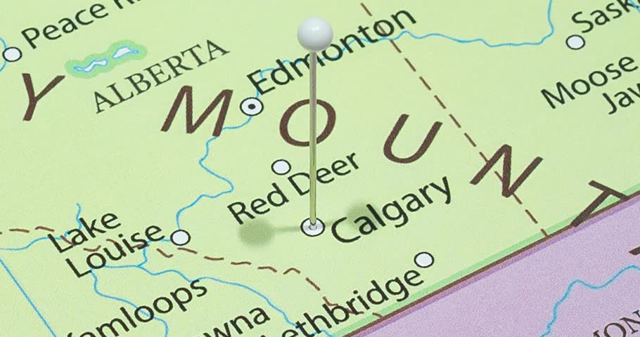 A zoom out of a white pin into a Calgary city of Canada political map