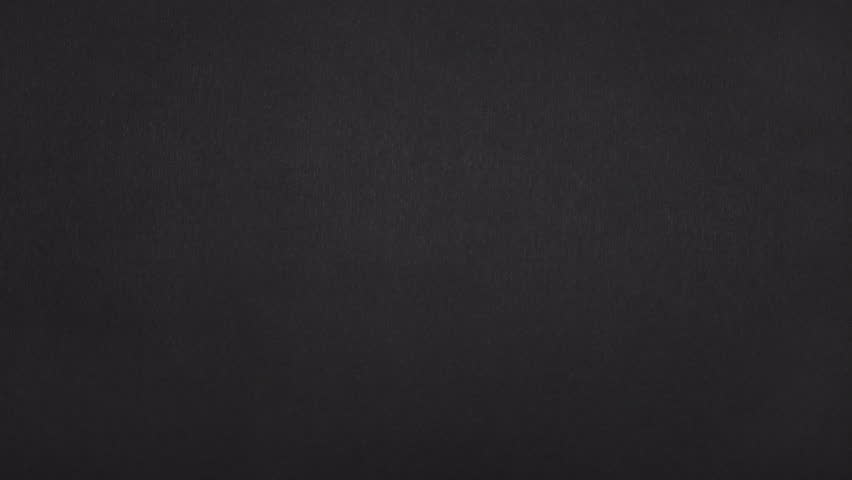 Real black paper rips into a narrow third that slides left, then the remaining paper moves right to reveal.